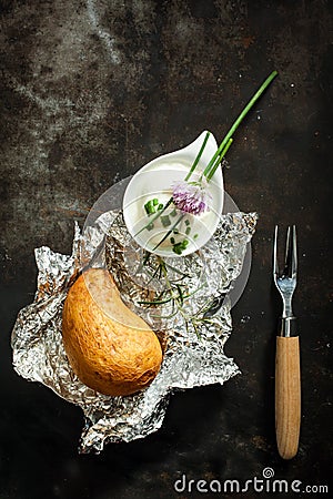 Baked jacket potato , chives and sour cream