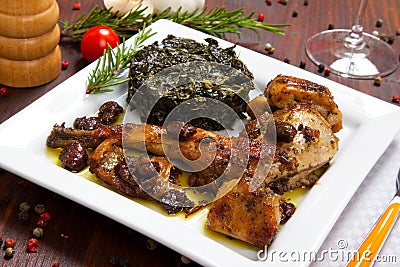 Baked rabbit with vegetables in a dish