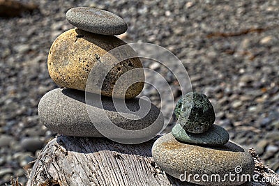 Balanced rocks on log
