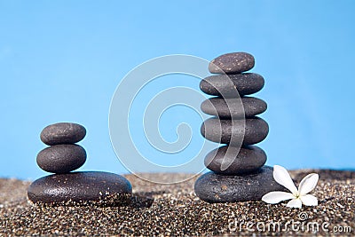 Balanced stones on the sand