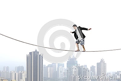 Balancing on rope with city view