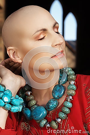 Bald woman in red