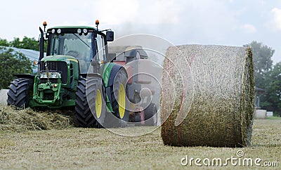 Baling hay in field