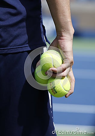 Ball boy holding Wilson tennis balls at the Billie Jean King National Tennis Center