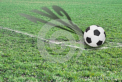 Ball on a football field with shadow showing possible score