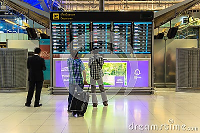 BANGKOK - APRIL 4 Passengers checking the flight schedule on airport charts at Suvarnabhumi Airport , on 4 April, 2014 in Bangkok