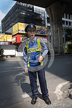 Bangkok security man in uniform on street