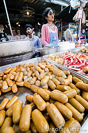 Bangkok,Thailand:Market woman selling sausages.