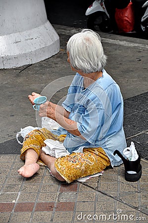 Bangkok, Thailand: Woman Begging on Silom Road