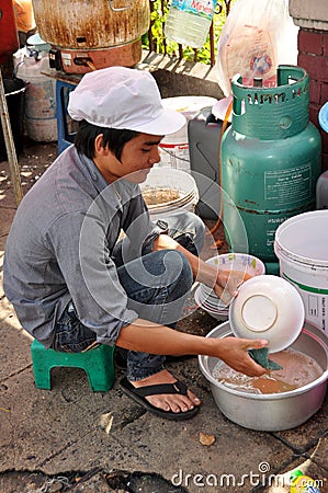 Bangkok, Thaland: Man Washing Dishes on Sidewalk