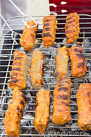Barbecue with ground meat rolls