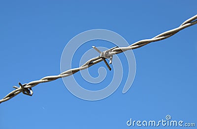 Barbed wire blue sky background