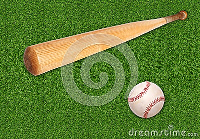 Baseball ball and bat on green grass background