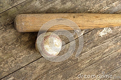 Baseball bat and ball on old grunge floor