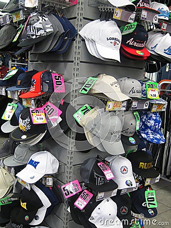 Baseball caps for sale in a store.