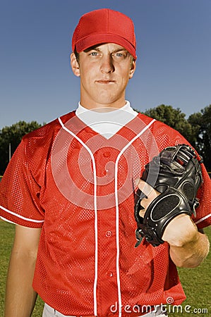 Baseball pitcher holding glove