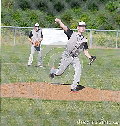 Baseball pitcher throwing the ball.