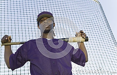 Baseball Player Holding Bat During Practice