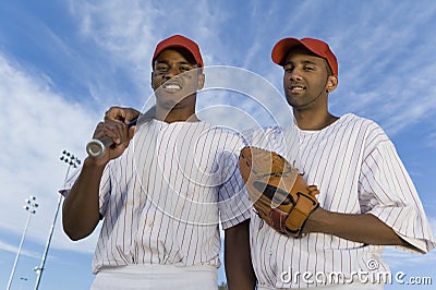 Baseball Team Mates Against Cloudy Sky