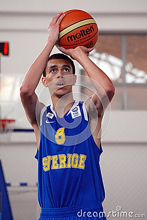 Basketball player shoots a penalty kick