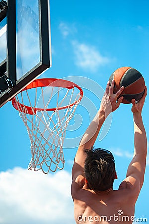 Basketball player throws a ball