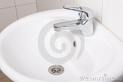 Bathroom interior with white sink and faucet