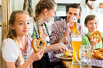 Bavarian girl with family in restaurant