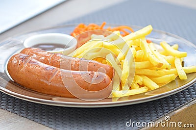 Bavarian sausages grilled with fries, carrots in Korean and sauce