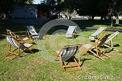 Beach chairs on the grass are waiting for a brainstorming work