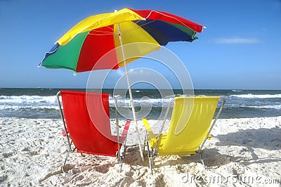 Beach Chairs and Umbrella in Sand