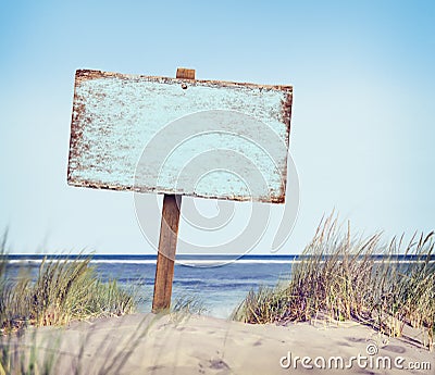 Beach with Empty Plank Sign