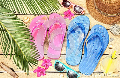 Beach, palm tree leaves, sand, sunglasses and flip flops