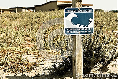 Beach sign states Tsunami Hazard Zone