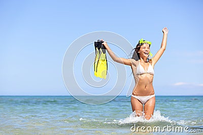 Beach vacation woman excited and happy snorkeling