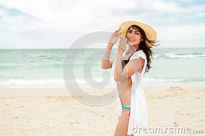 Beach vacation woman in sun smiling happy