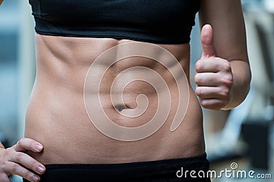 Beautifu Woman Showing Thumbs Up And Her Ab