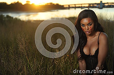 Beautiful African-American woman wearing black lingerie
