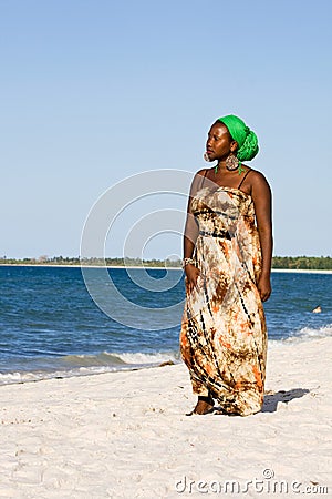 Beautiful african woman looking at the ocean