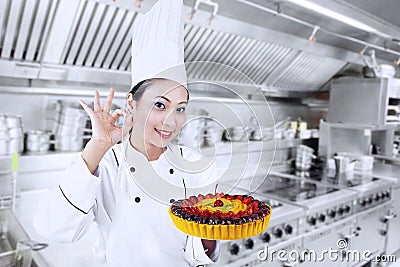 Beautiful chef cook delicious cake