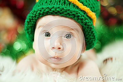 Beautiful baby in green knitting hat