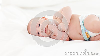 Beautiful baby lying in bed