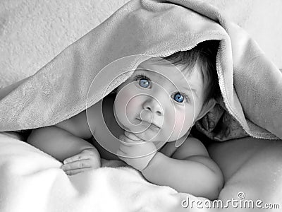 Beautiful baby under blanket
