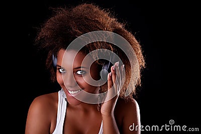 Beautiful black woman happy listening music