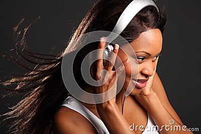Beautiful black woman music lover listening