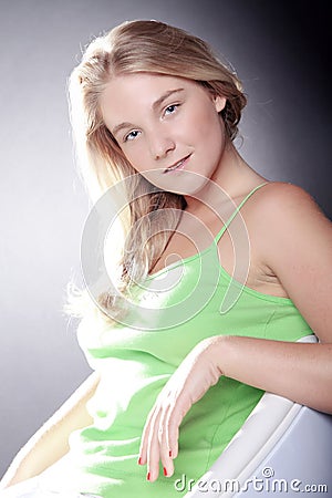 Beautiful blond woman in chair