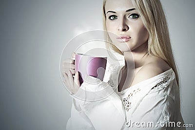 Beautiful blond woman with Coffee or tea.Hot drink Cup