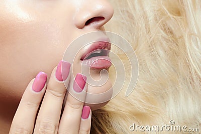 Beautiful blond woman.lips,nails and hair