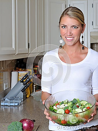 Beautiful blonde woman in kitchen
