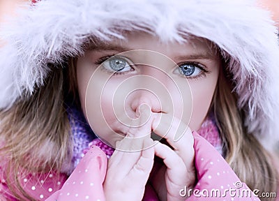 Beautiful blue-eyed girl who warms frozen hands