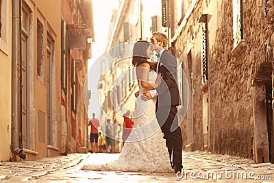 Beautiful bridal couple at sunset on the streets of Venice